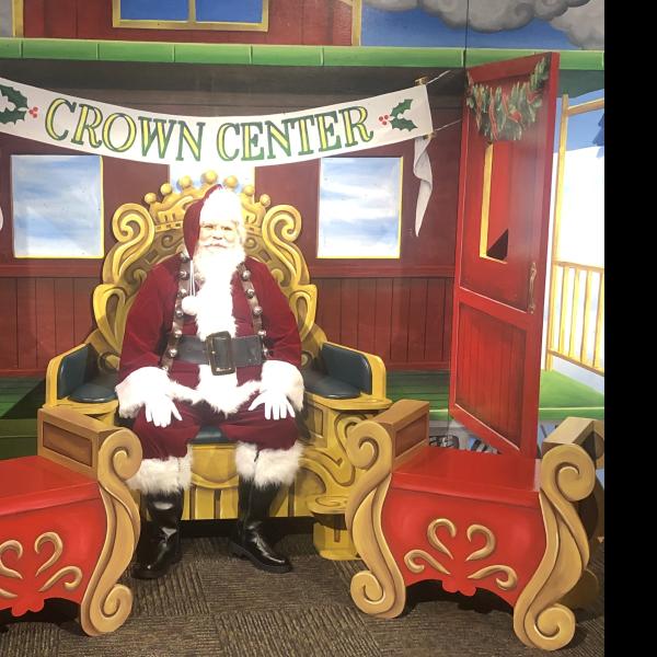 Santa sitting in Gingerbread Station